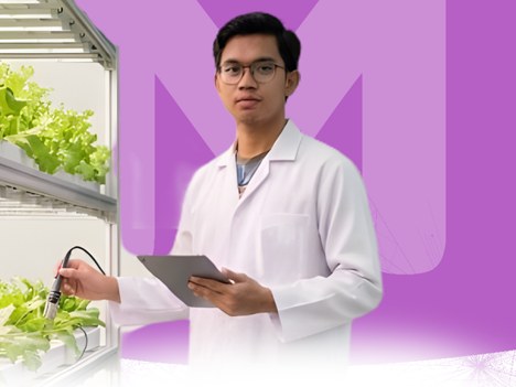 Agrotechnology student testing plants in a vertical farm
