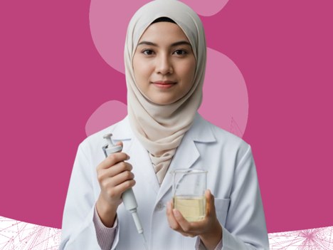 Food Technology student holding a pipette and a beaker